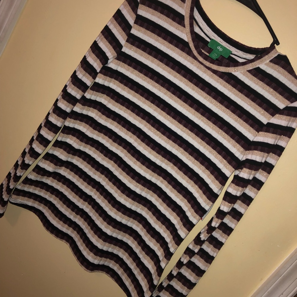 Dip sweater. burgundy, gold, white, and black.
